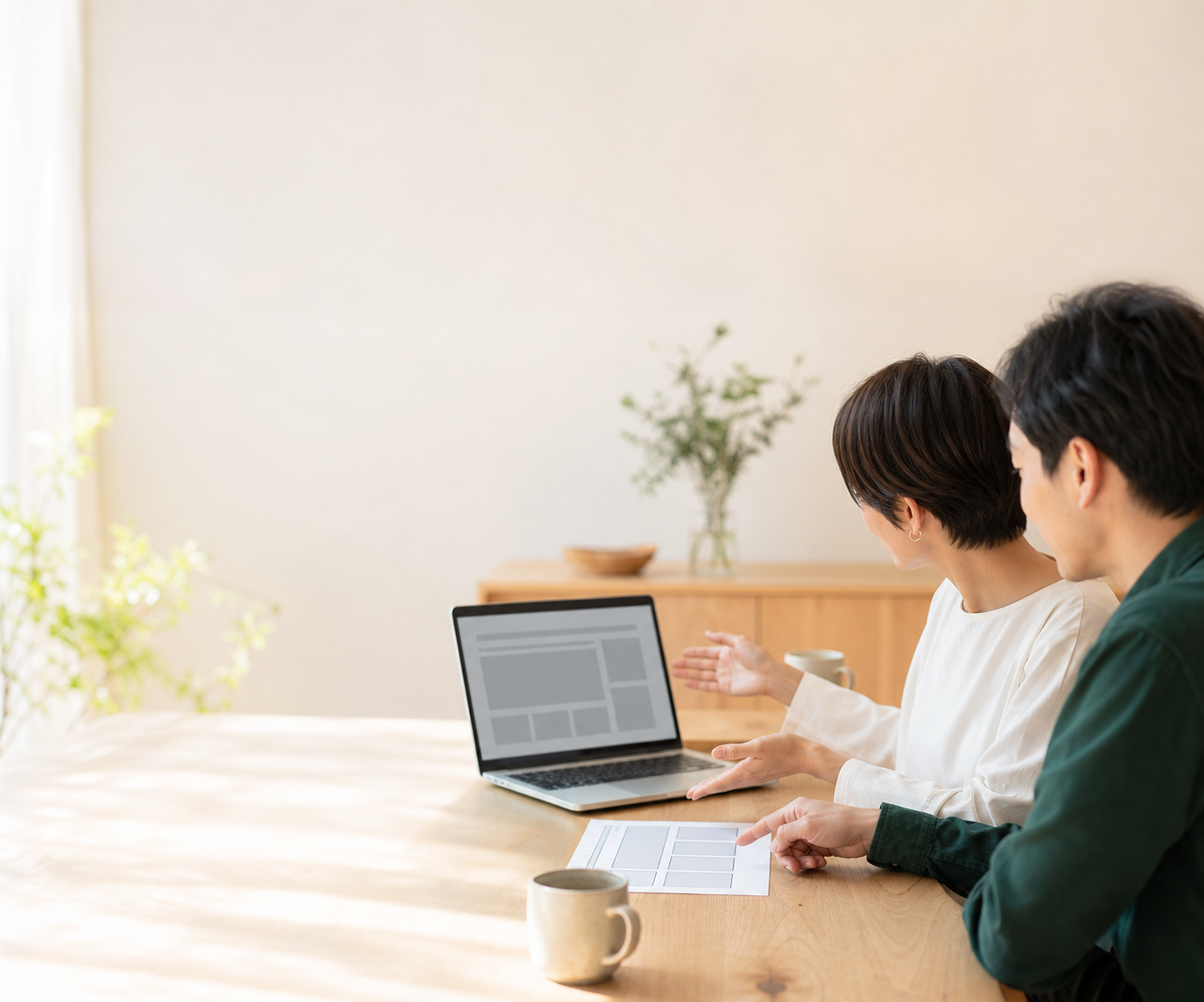 Two people reviewing a website plan together